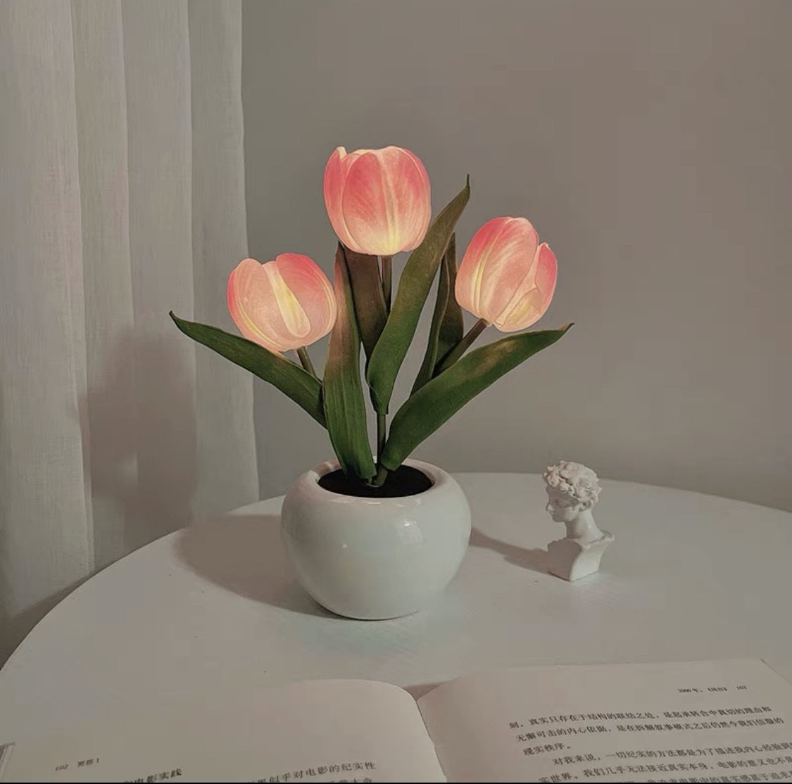 Pink tulip night light with faux tulip stems in white ceramic pot