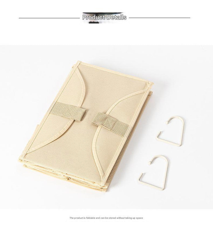 Folding beige hanging storage bag with reinforced pockets and two metal hooks