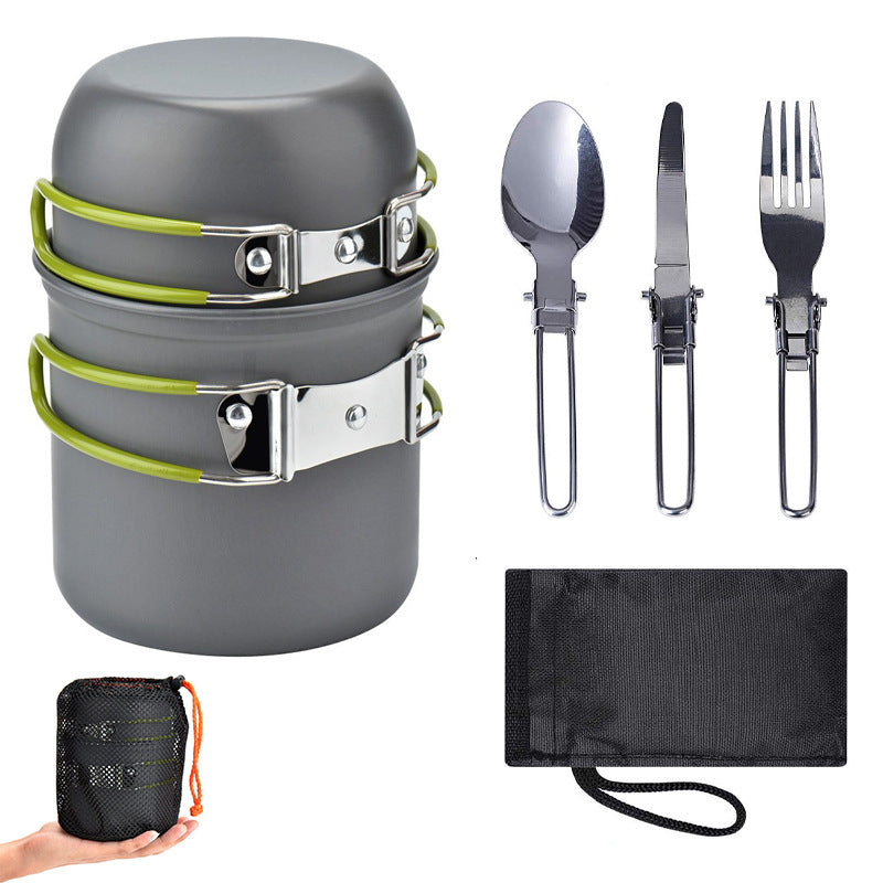 Compact camping cookware set with gray pot, green straps, stainless utensils, and storage cloth