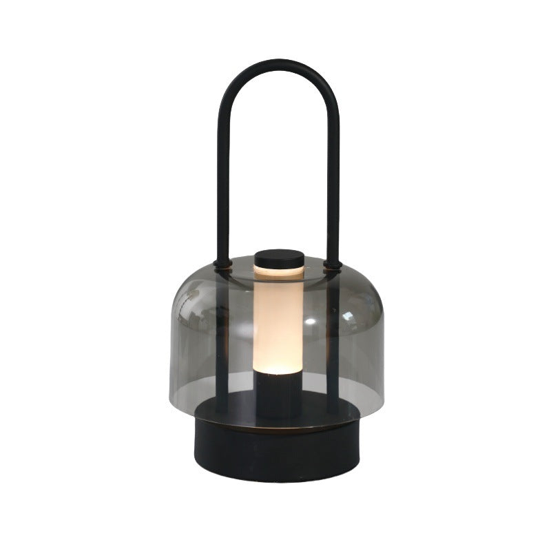 Black portable rechargeable LED lantern with smoked glass shade and carry handle