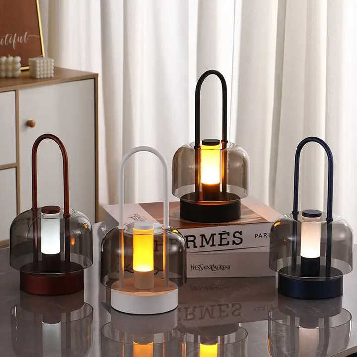 Set of portable LED lanterns with smoked glass shades and black, bronze, and blue bases