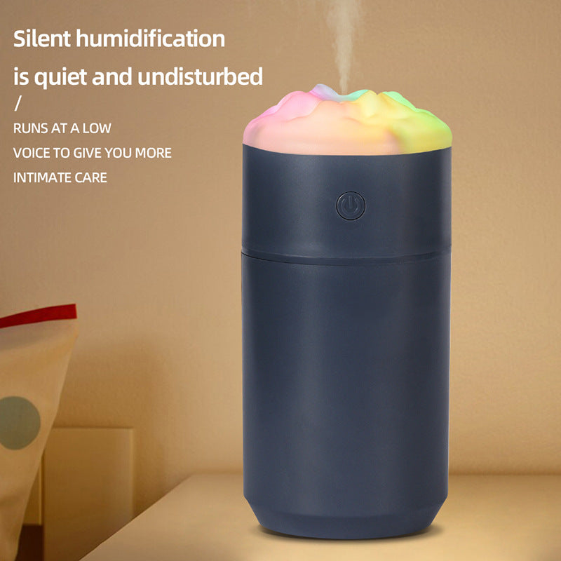 Portable humidifier in dark blue with rainbow lighted top