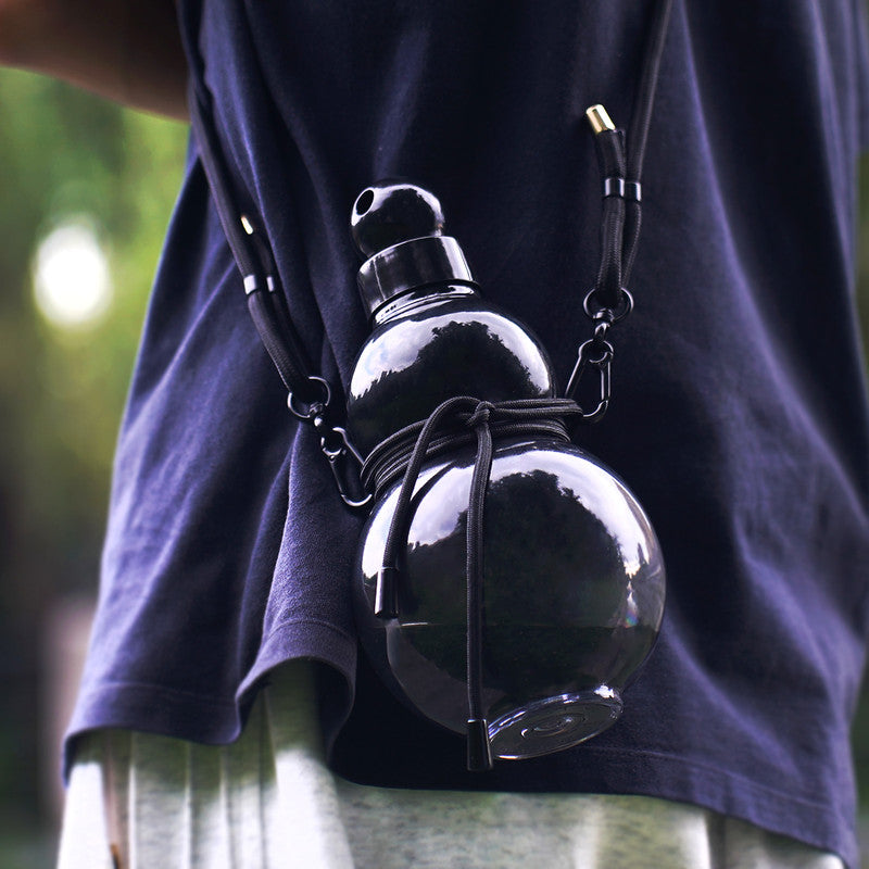 Set of glossy black gourd water bottles with metal-look caps and lanyard cords