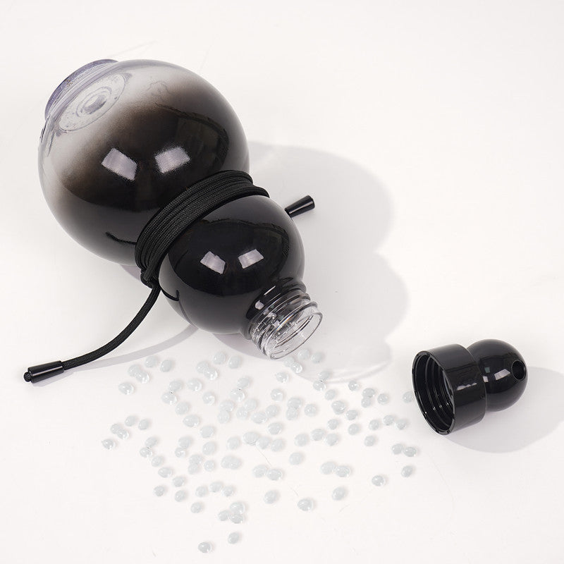 Black gourd-shaped flask with cap, spout, and strap cord shown unassembled