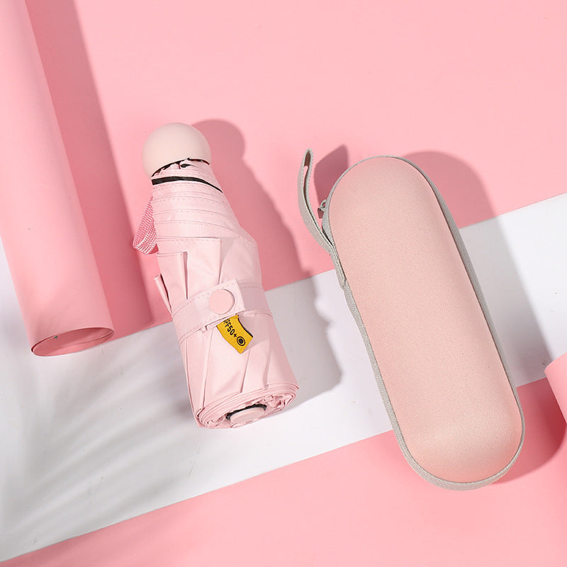 Pink compact 5-fold umbrella, folded with matching carry sleeve.