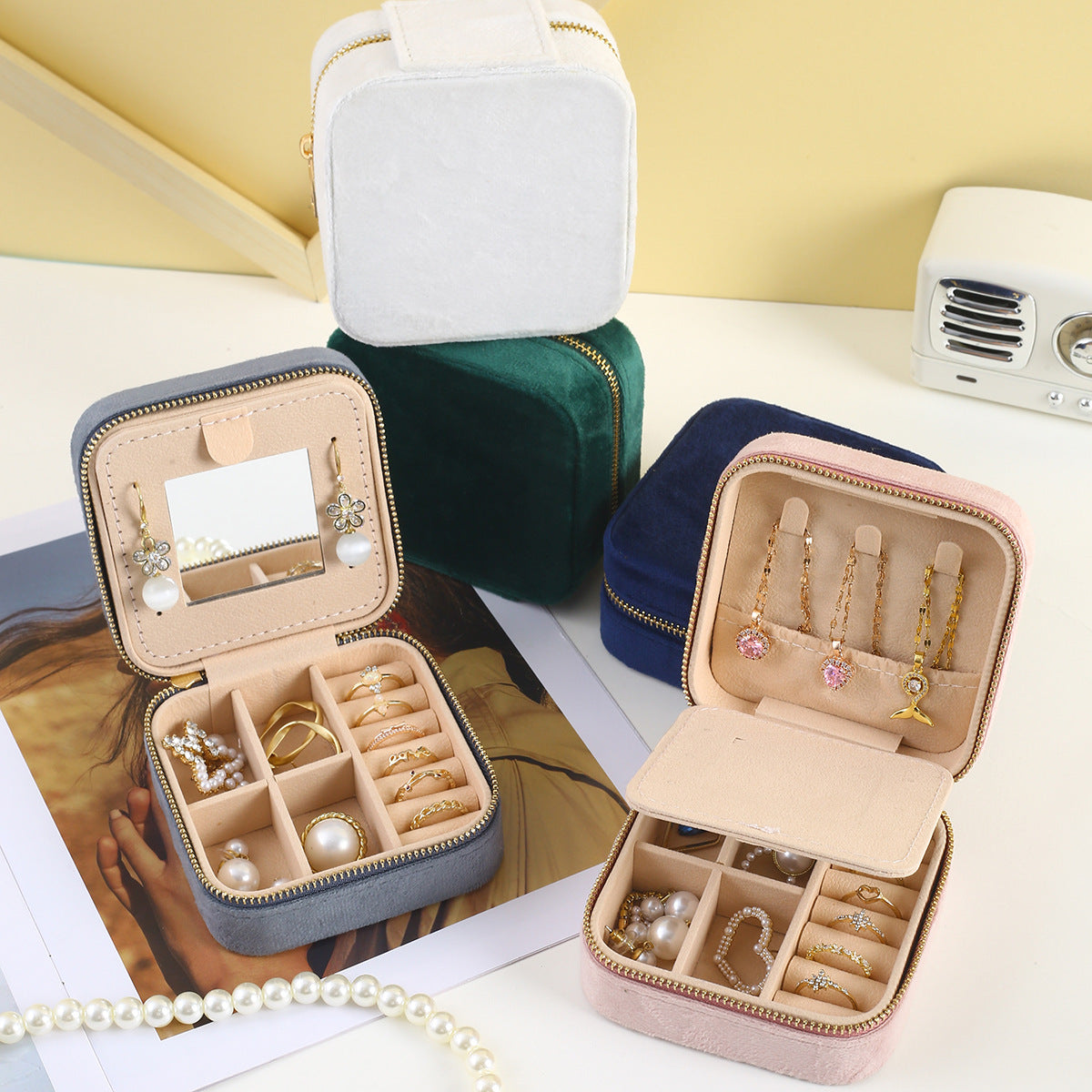 Portable jewelry boxes with open compartments and inner mirror windows for rings