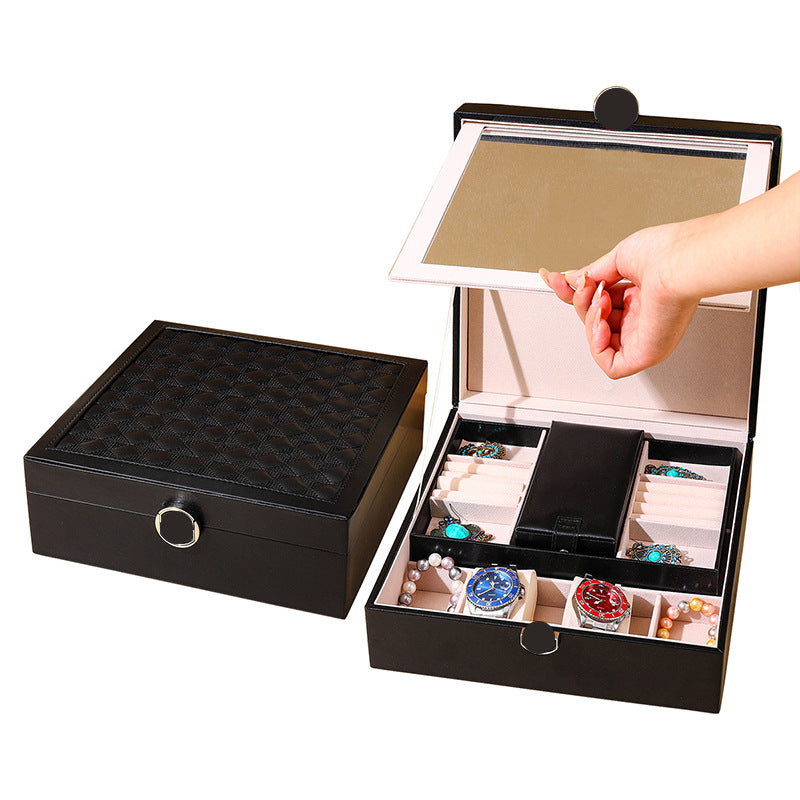 Black quilted jewelry storage box with lift lid and mirrored interior compartments