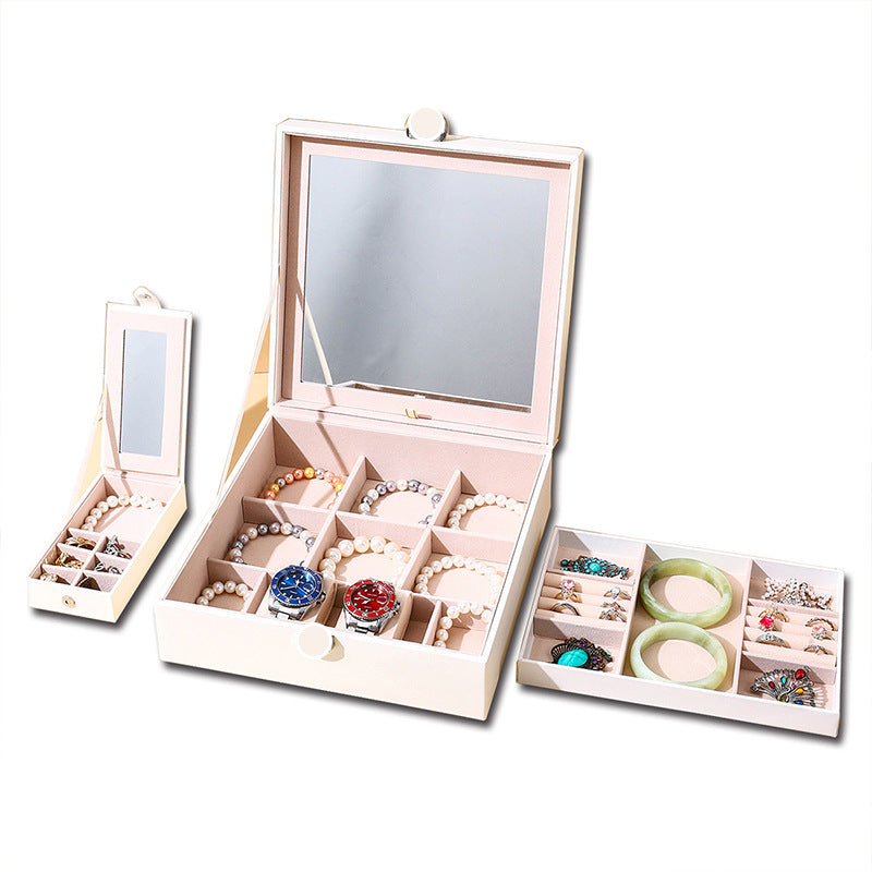 White jewelry storage box with mirrored lid and multi-level ring and bracelet trays