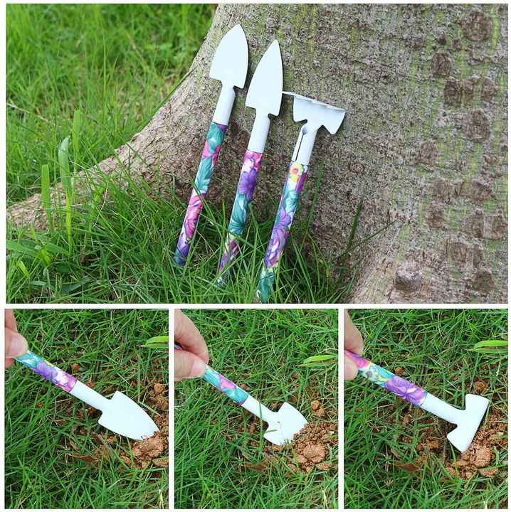 Three gardening hand tools with floral handles and white blades in grass