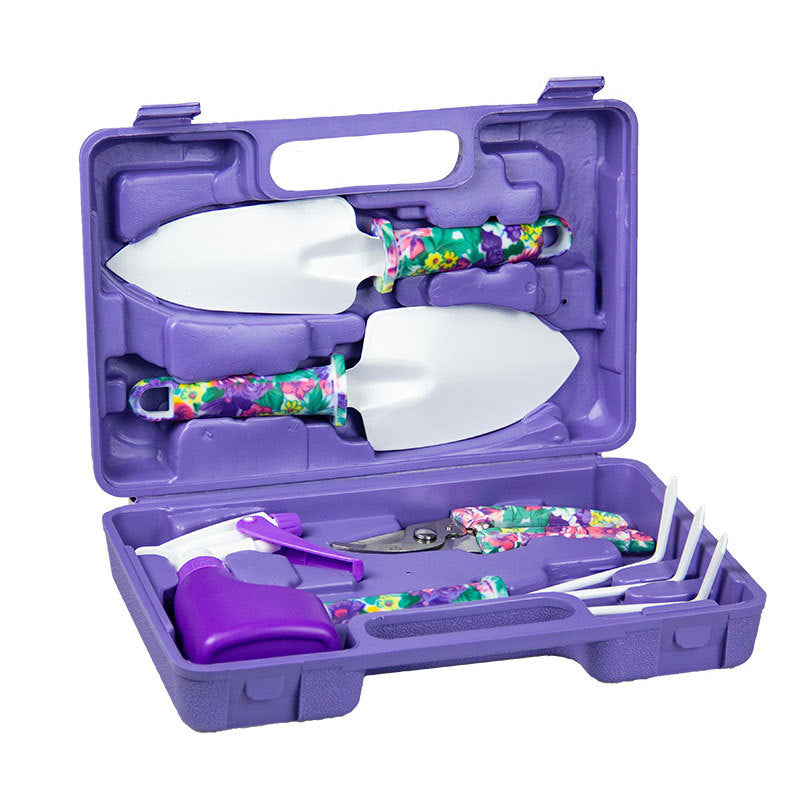 Purple gardening tool set in open compact case with three metal hand tools