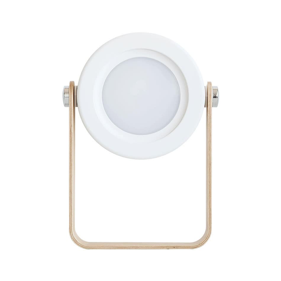 White lantern-style desk lamp with circular glowing diffuser and wood handle
