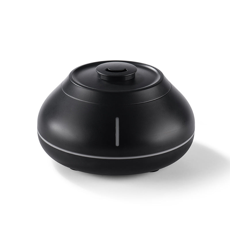 Black ultrasonic aroma diffuser with top control button and center mist outlet