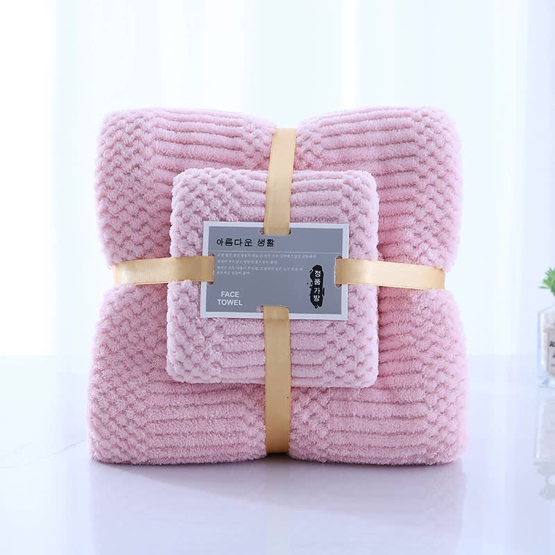 Pink coral fleece bath and face towel set, two folded towels with tan straps