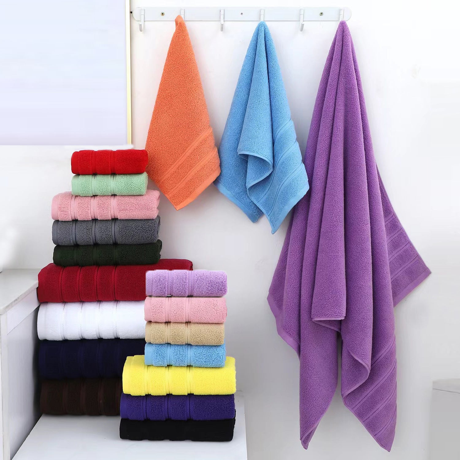 Colorful cotton towel set with folded and hanging towels in multiple shades