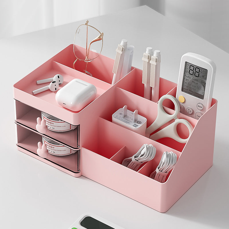 Pink drawer-style makeup organizer with divided top sections and two pull-out drawers
