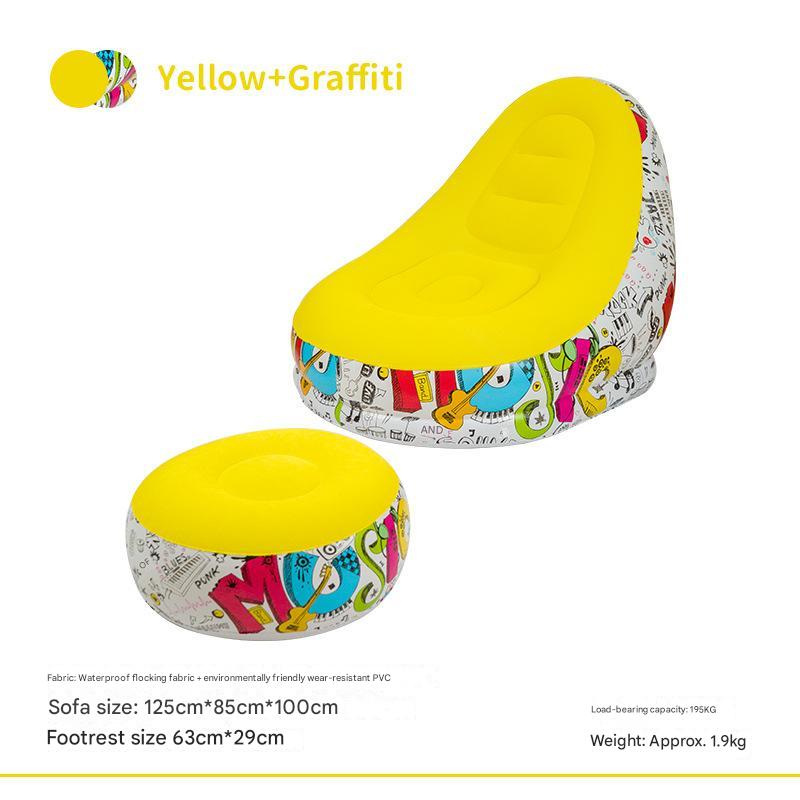 Inflatable sofa chair with ottoman, yellow padded seat and graffiti-pattern sides