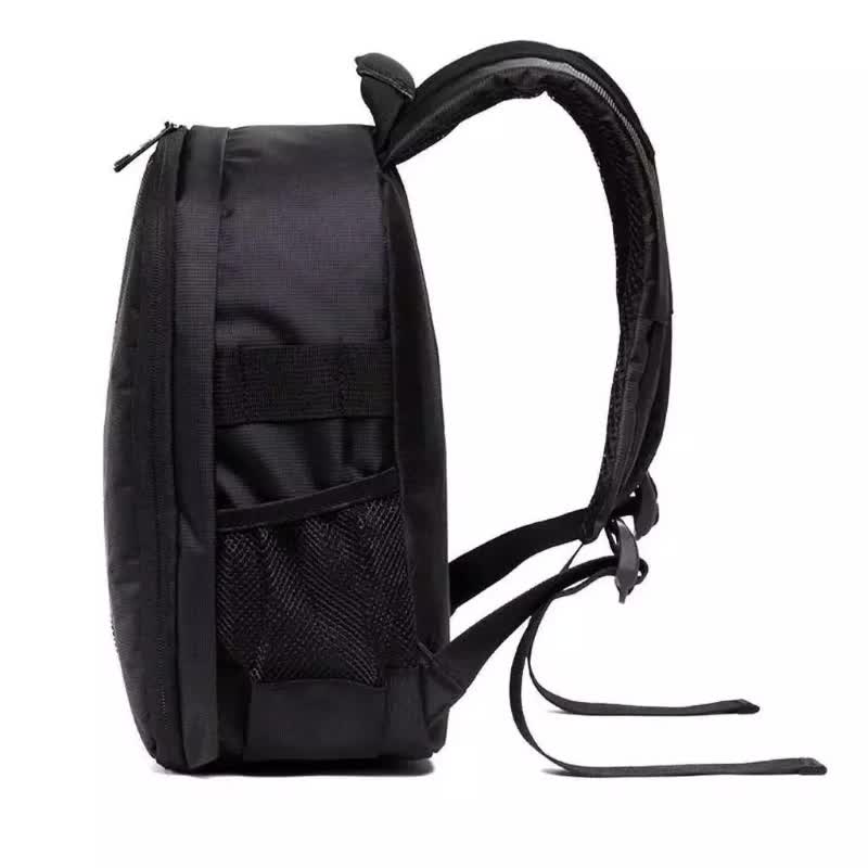 Black camera backpack side view with front mesh pocket and carry handle