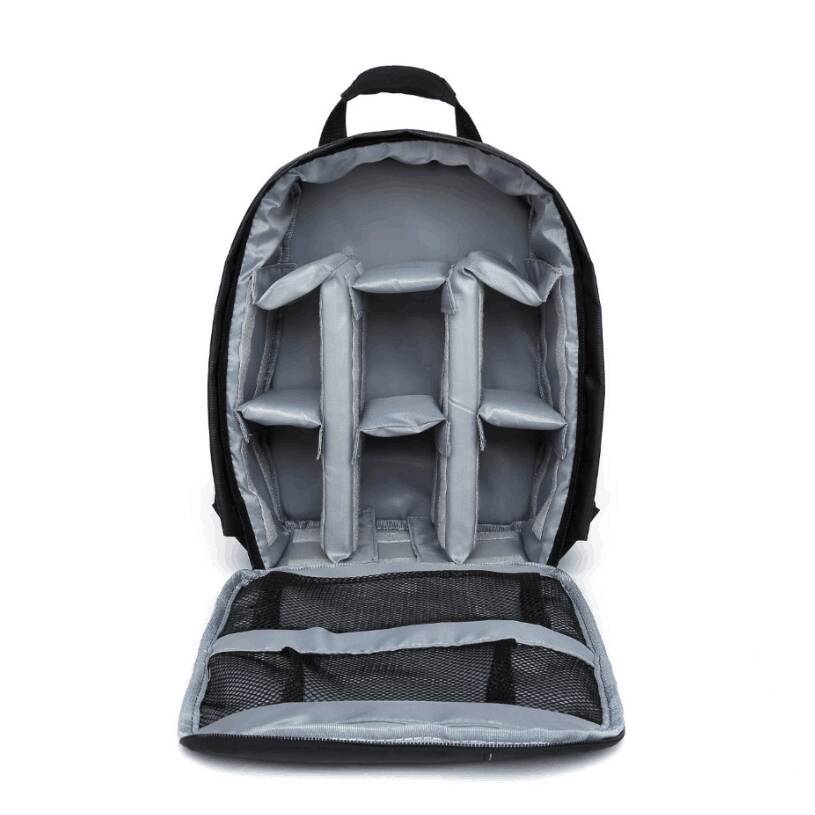 Black camera backpack with open padded interior compartments and top zip opening