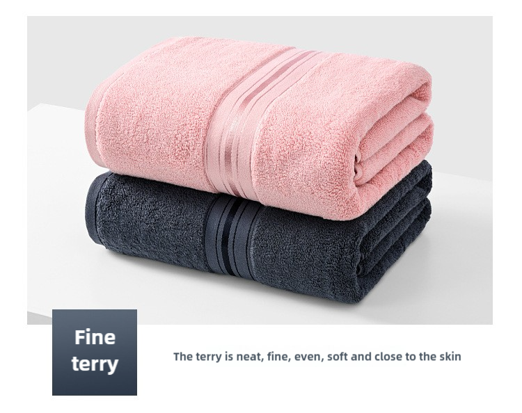 Towel set with folded pink towel layered on dark blue towel, neatly stacked