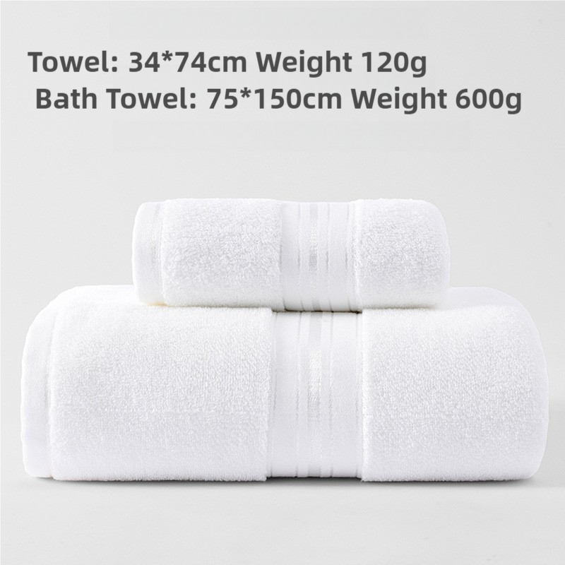 Cotton towel set in white, neatly folded and rolled with stitched bands