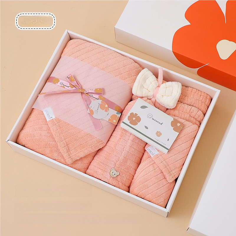 Coral pink fleece towel gift set with folded bath towels in a box
