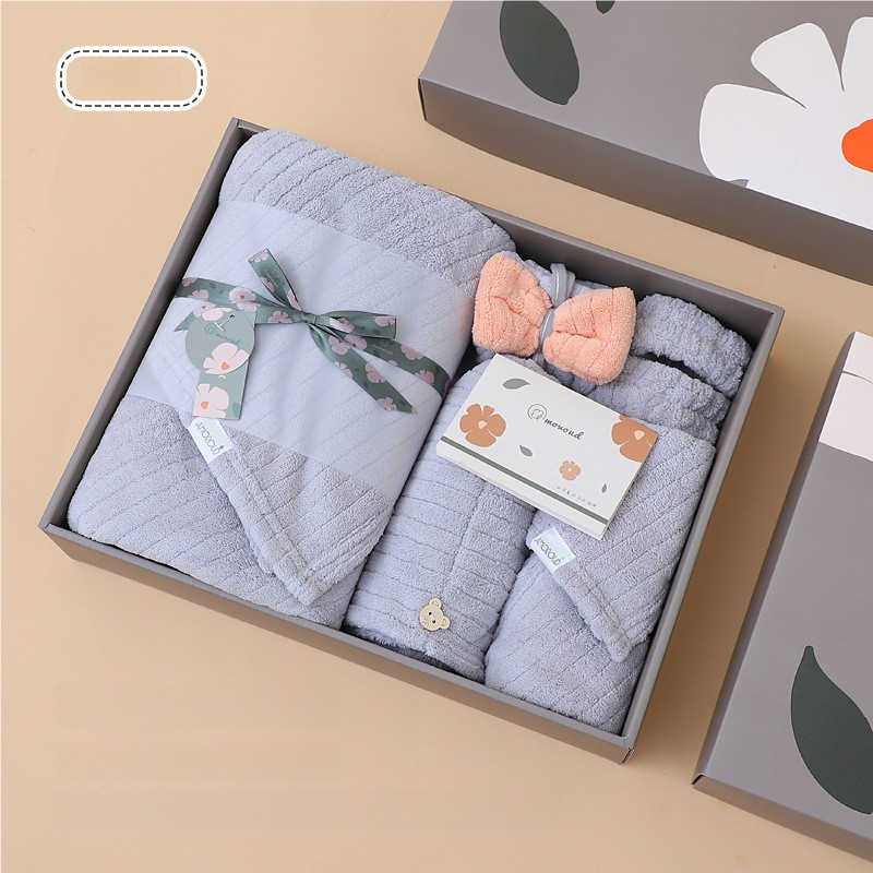 Fleece towel gift set in open box with folded towels and small washcloths.