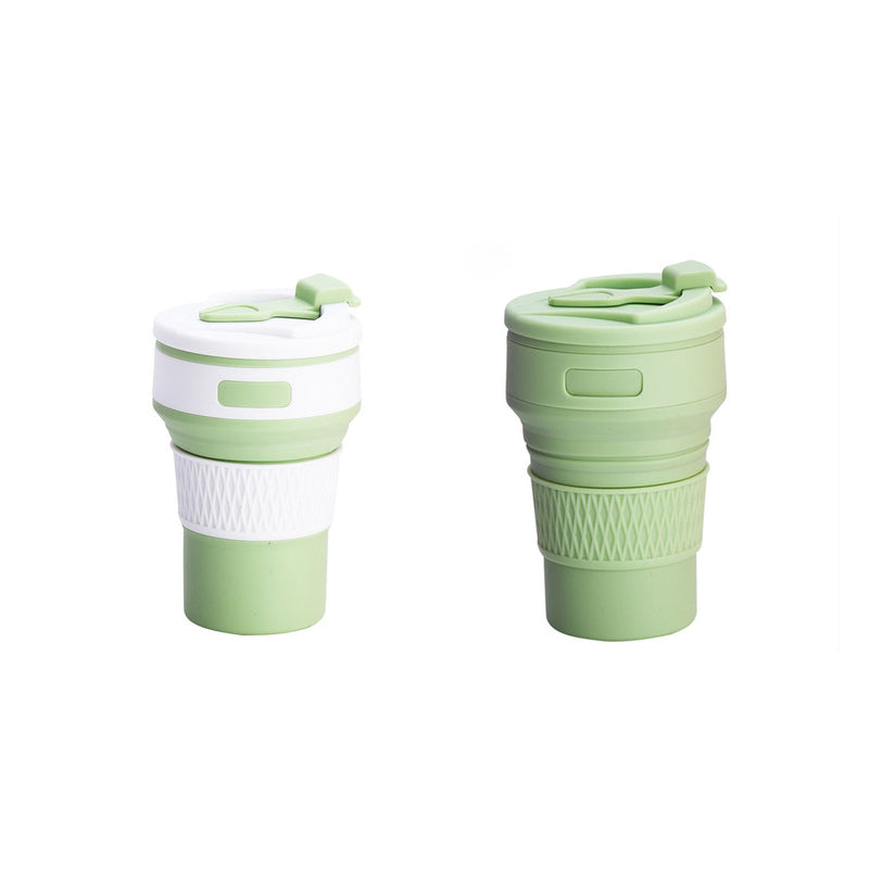 Green collapsible silicone coffee cup set, both cups folded with flip lid