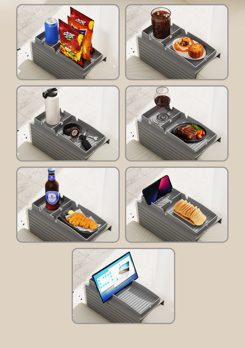 Grey sofa armrest tray with ribbed surface for cups, snacks, and a phone