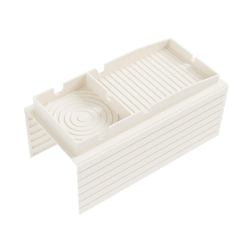 Beige sofa armrest cup holder tray with divider slots and circular coaster insert