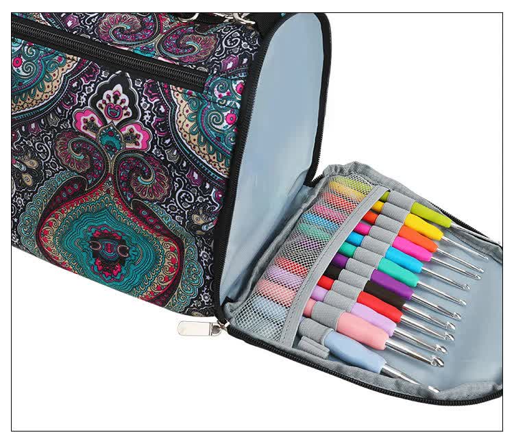 Leaf-pattern crochet yarn storage bag with foldout needle roll, showing multicolor crochet hooks