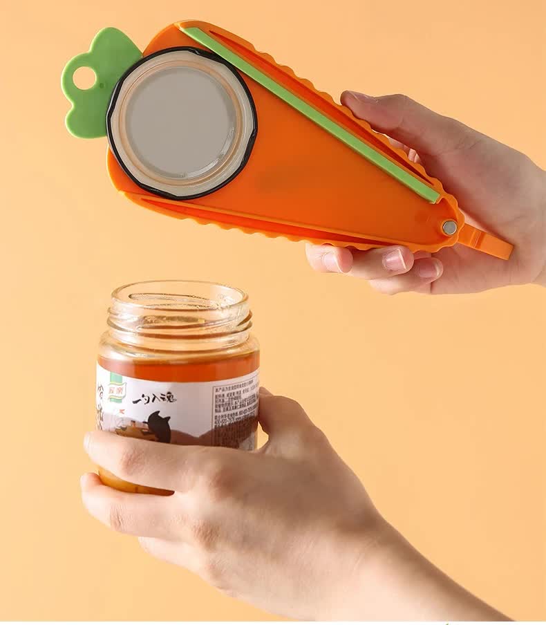 Orange carrot-shaped opener held over a jar lid