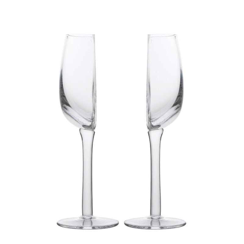 Set of 2 crystal wine glasses, clear half-round bowls on long stems, round bases.