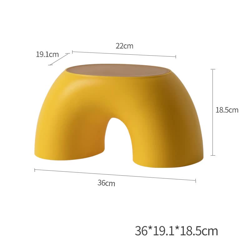 Yellow round plastic footstool with arched cutout seat, non-slip design