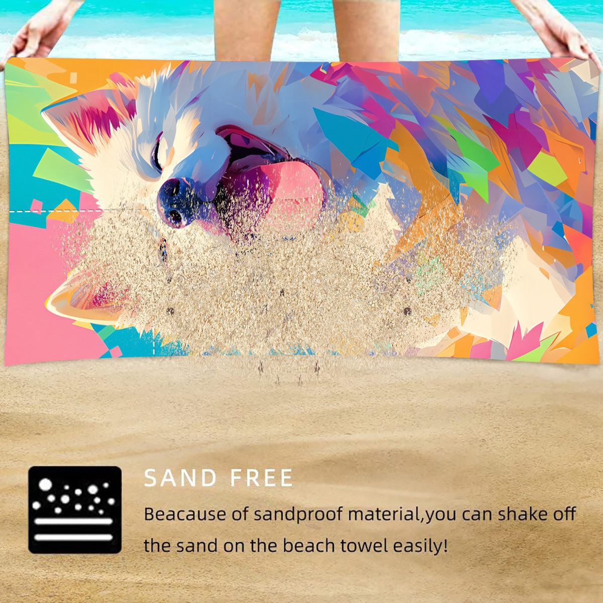 Colorful dog face beach towel with sand scattered across the fabric