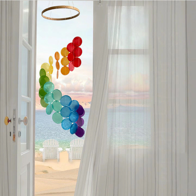 Rainbow seashell wind chime with layered hanging circular discs