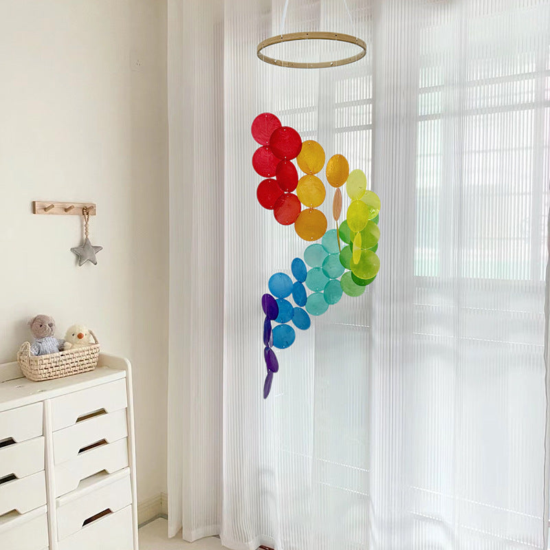 Bohemian seashell wind chime with red, yellow, green, blue, and purple shell discs