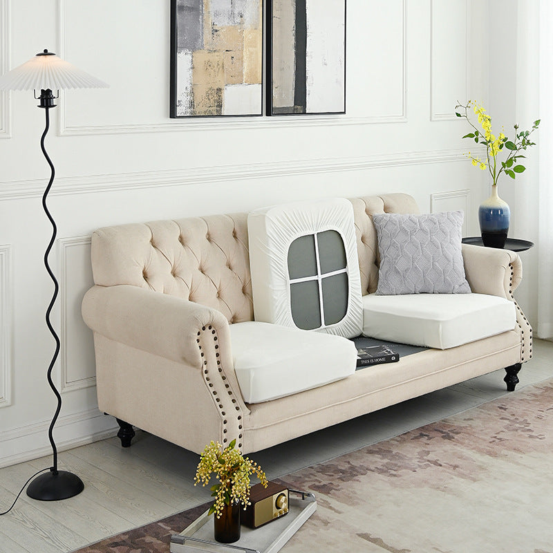 Cream sofa slipcover set with cutout window panel on backrest and seat