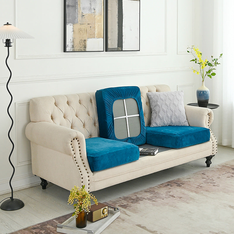 Peacock blue sofa cover with fitted back and arm over the couch