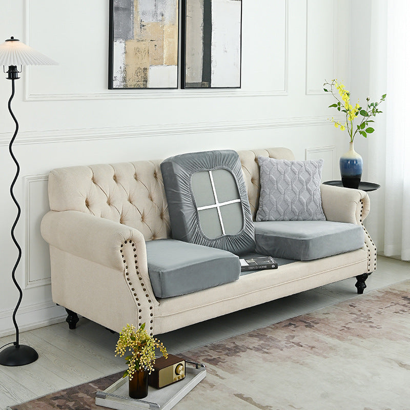 Grey sofa cover set with fitted back panel and arm sections for a tufted sofa