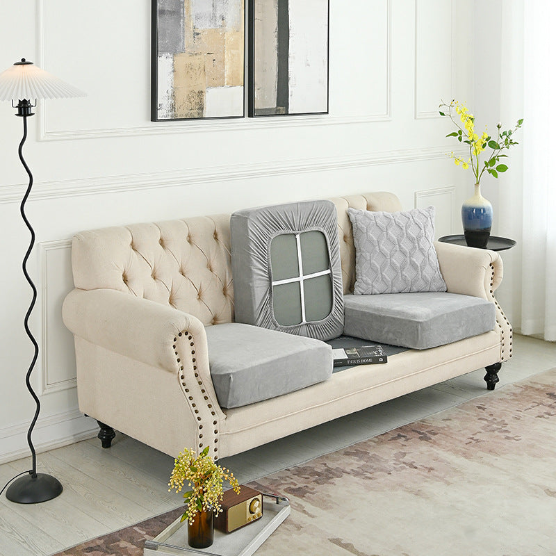 Light beige sofa cover fitted over a tufted loveseat with a window-style back panel
