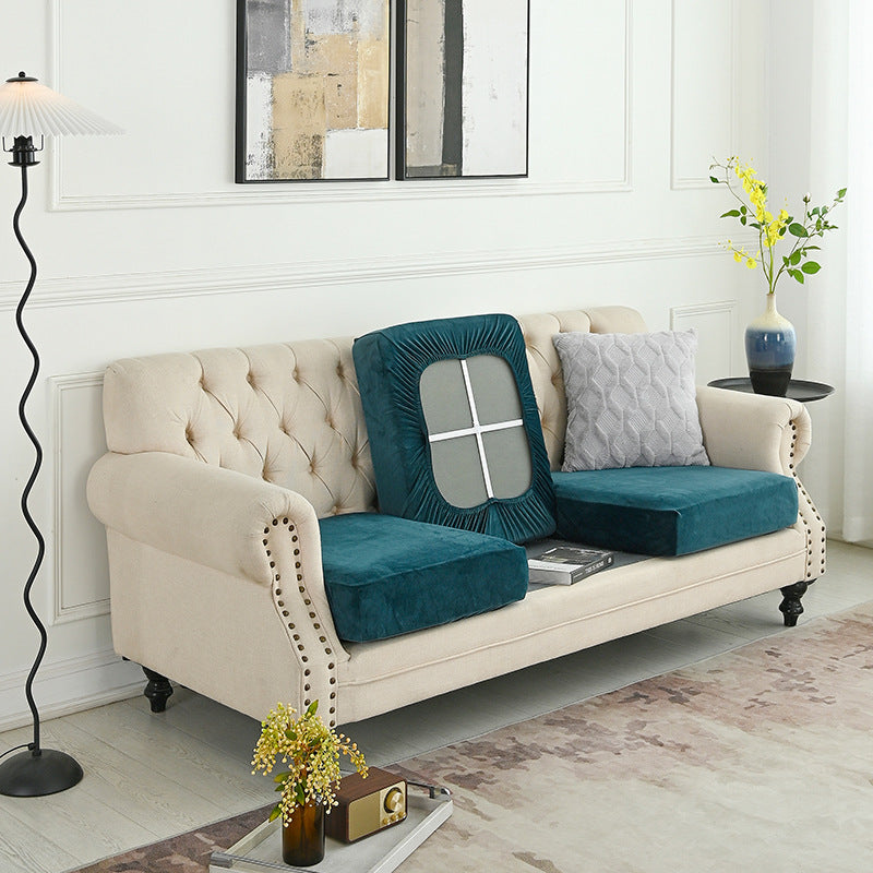 Teal sofa slipcover with rounded window panel over a loveseat