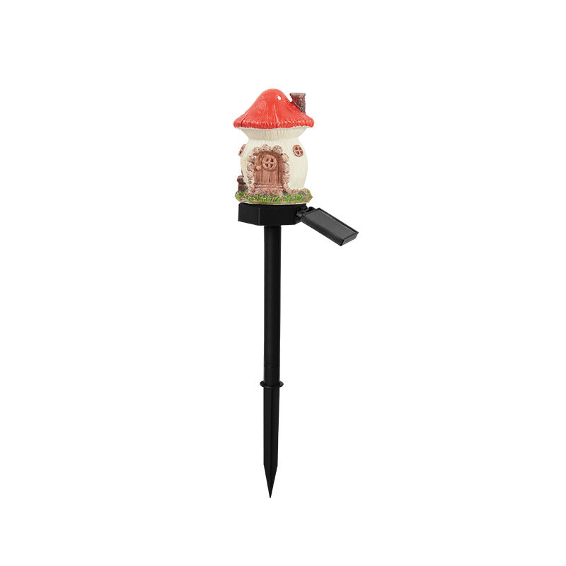 Solar resin garden stake light with white house body, red roof, and black stake