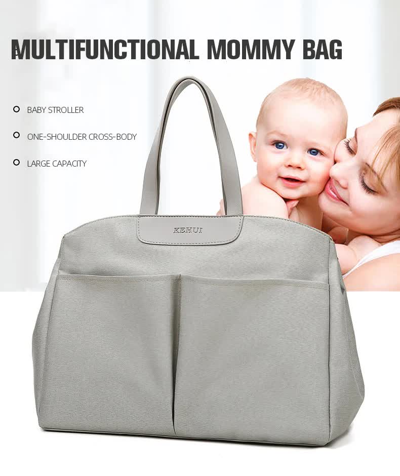 Grey diaper bag tote with top handles and front storage compartments