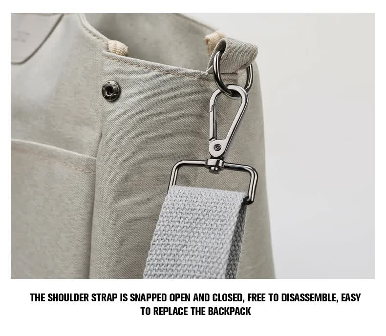Diaper bag front with snap strap hardware and detachable clip for shoulder strap