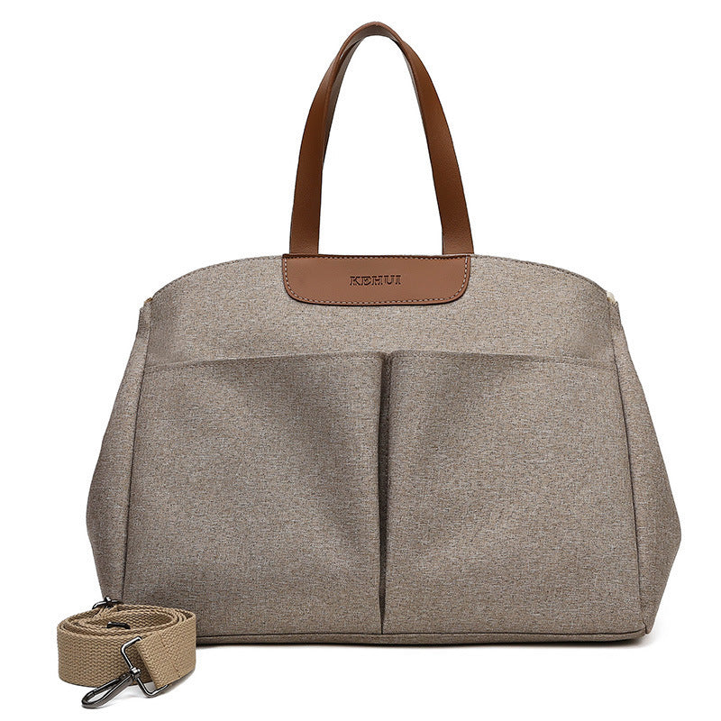 Gray diaper tote bag with two top handles and front center divider panel