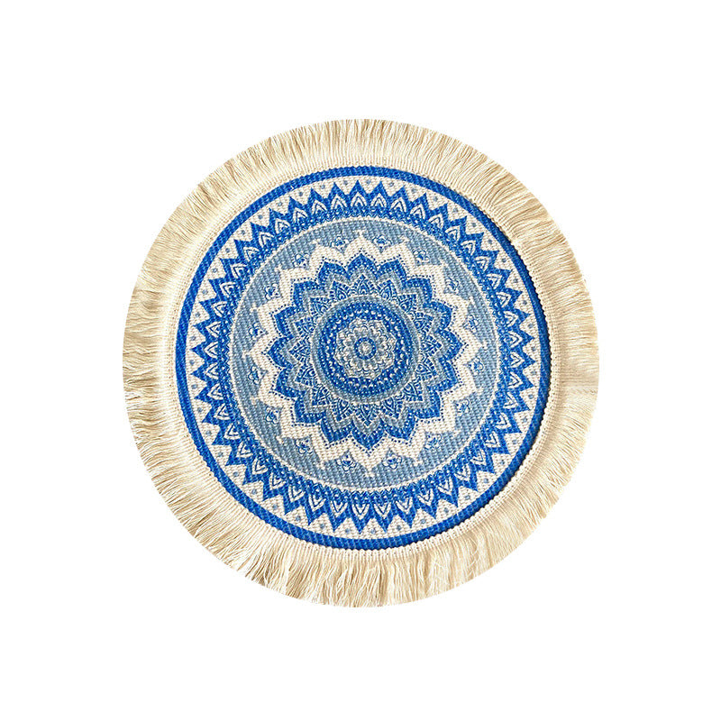 Round woven cotton placemat, bright blue circular mandala with cream fringe tassels