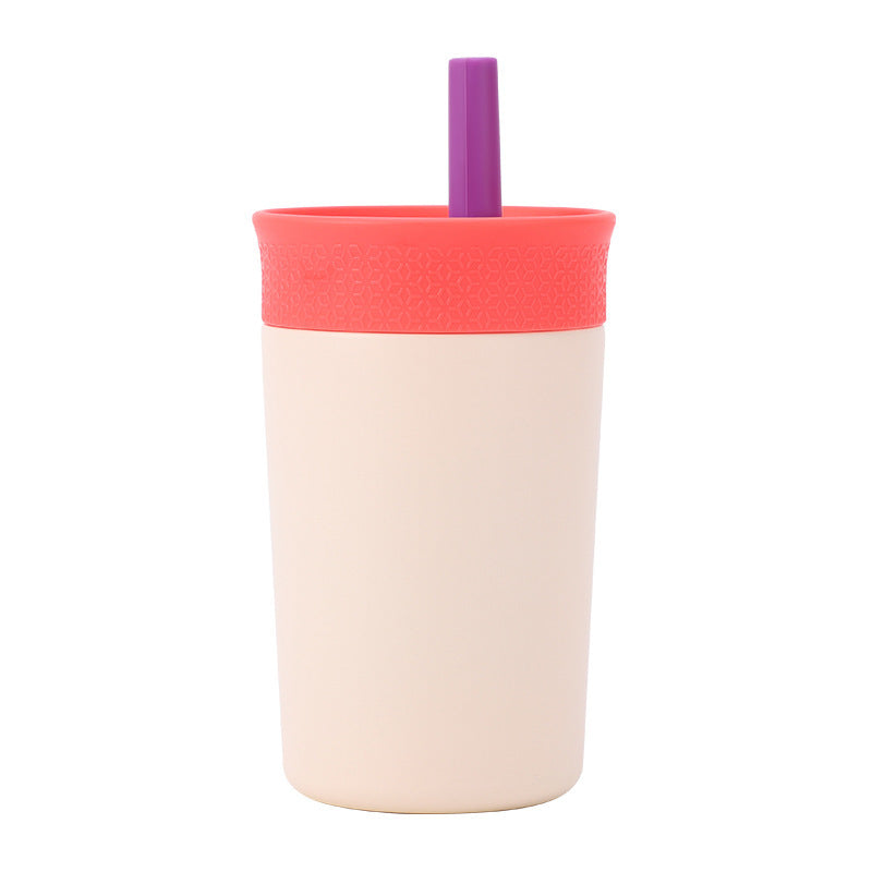 Beige insulated tumbler with purple straw and matching lid