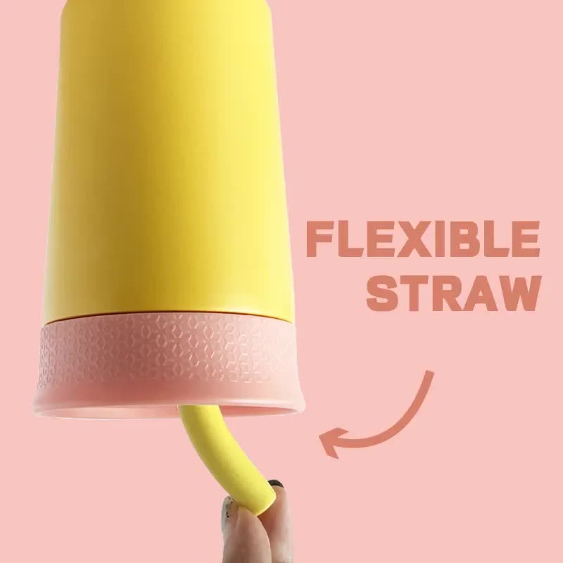 Yellow insulated tumbler with flexible straw and ribbed silicone band at base.