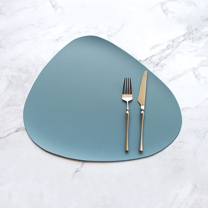 Triangular blue placemat with two utensil handles centered on it