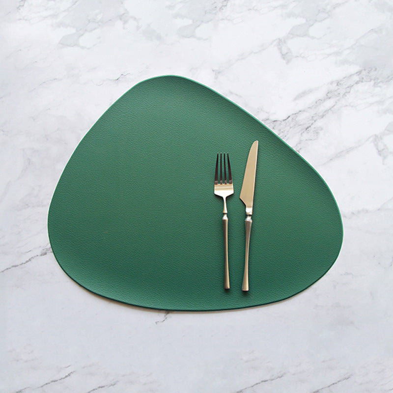 Triangular green PVC leather placemat with textured, pebble-grain surface.
